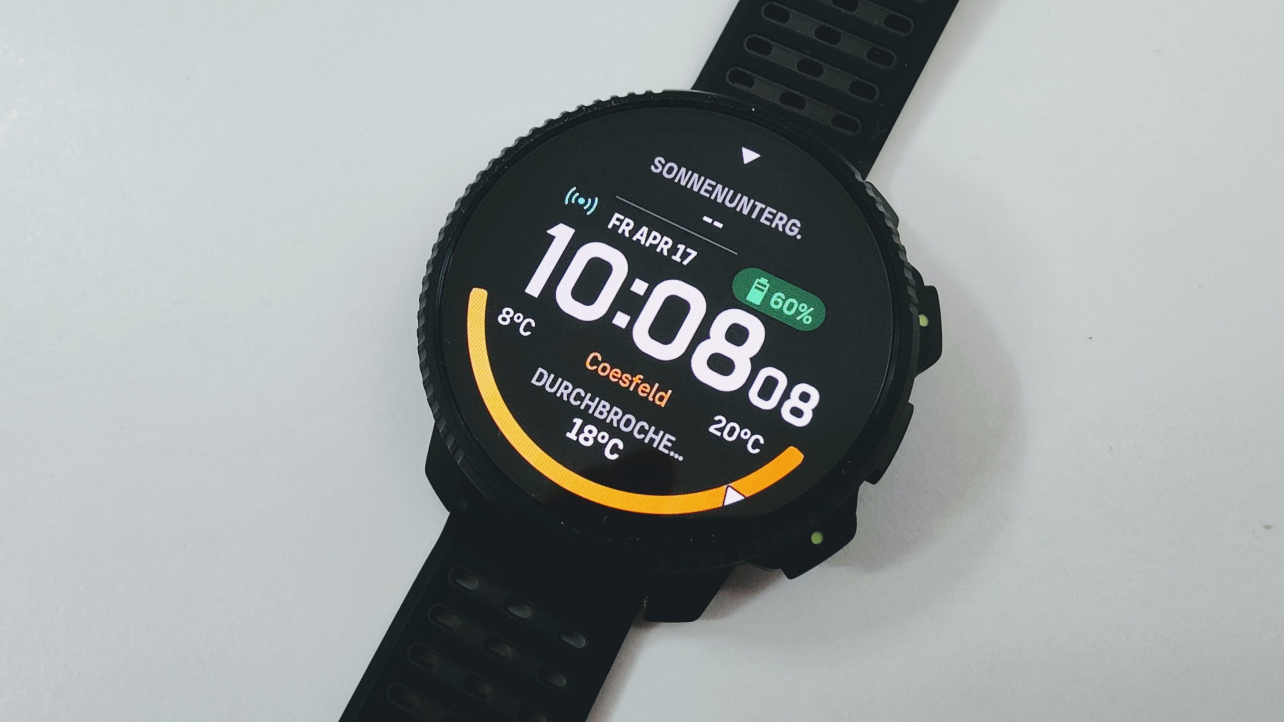 Smartwatch screen showing time 10:08, date Apr 17, battery at 60%, weather 8°C, orange activity ring on a black wristband.