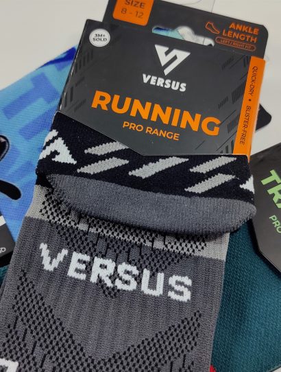 Packaging for Versus Running socks: ankle-length, Pro Range, assorted colors, tags visible on each package