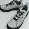 Light beige running shoes with black laces and gray accents on a white surface.