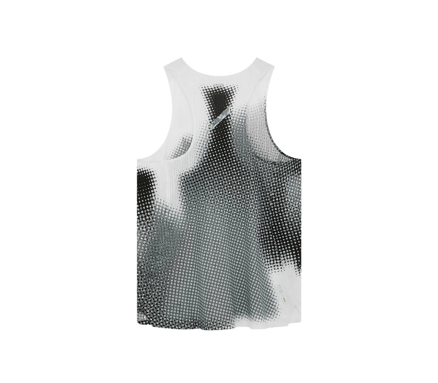 White sleeveless tank top with a black halftone dot pattern across the front. - Front view of a white tank top featuring a large black dotted abstract design. - White sleeveless shirt with an allover grayscale dotted pattern. - Graphic-pattern tank top with a white background and black dot motif.