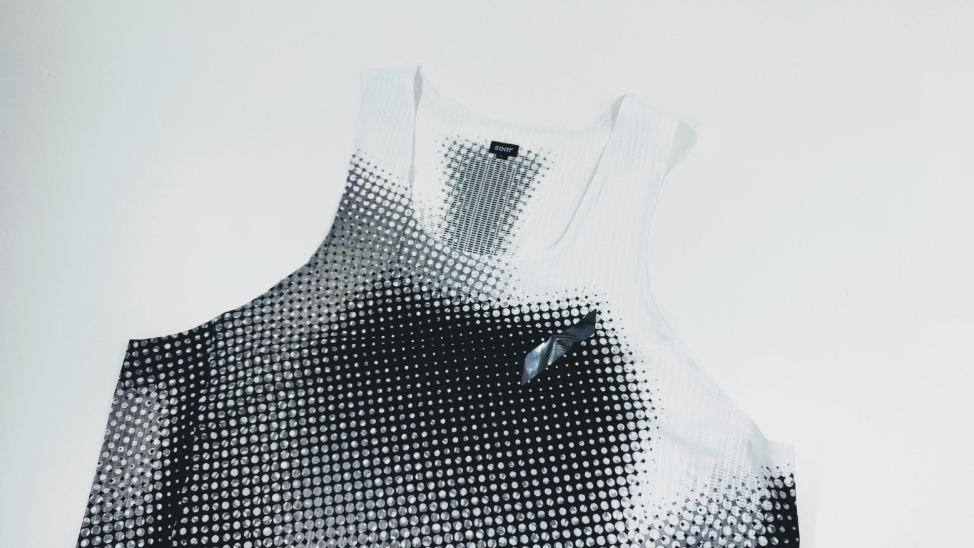 White and black sleeveless top with a dotted halftone gradient pattern