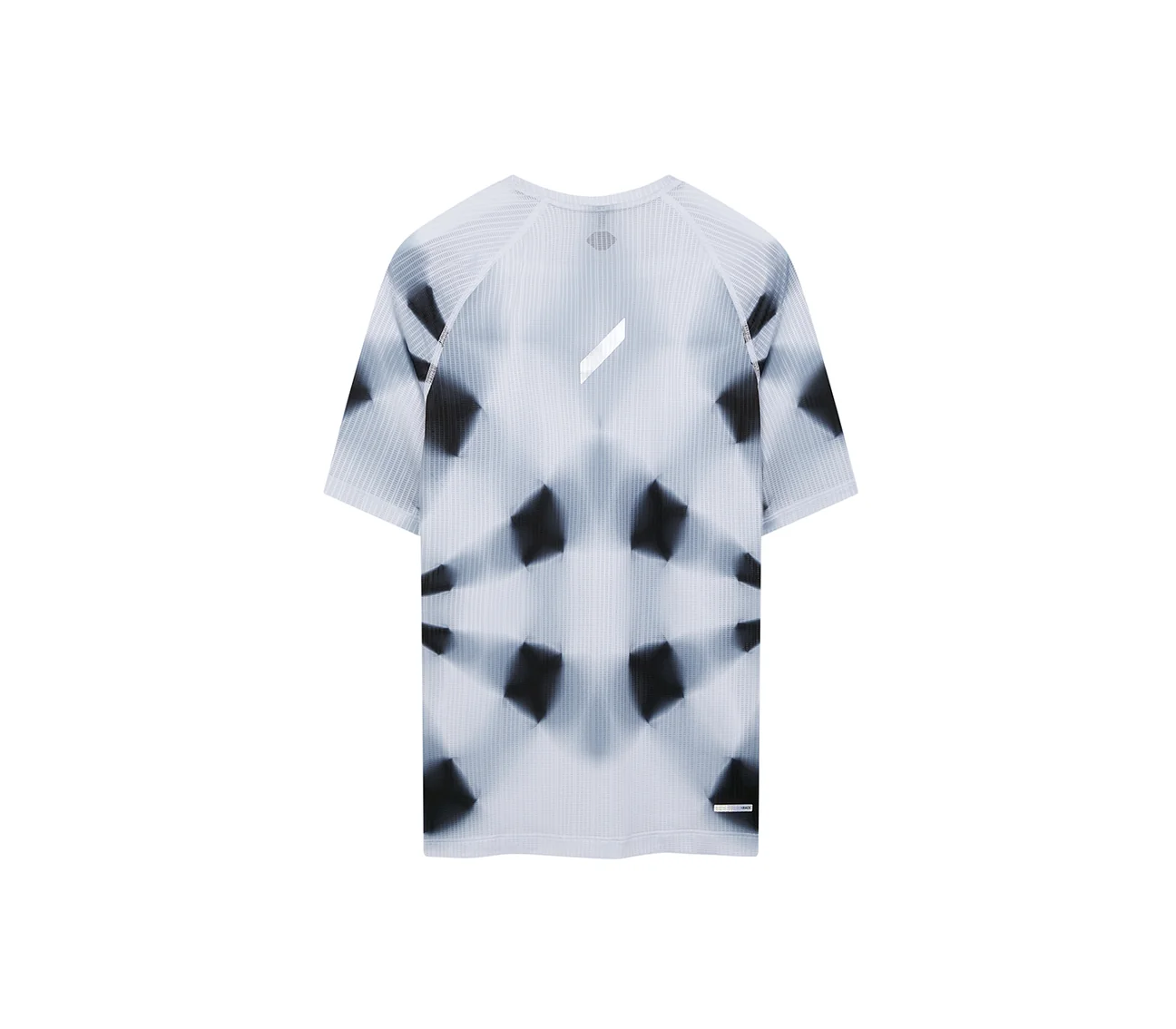 Back view of a white short-sleeve running shirt with a blurred black kaleidoscope pattern and a small white logo between the shoulders.