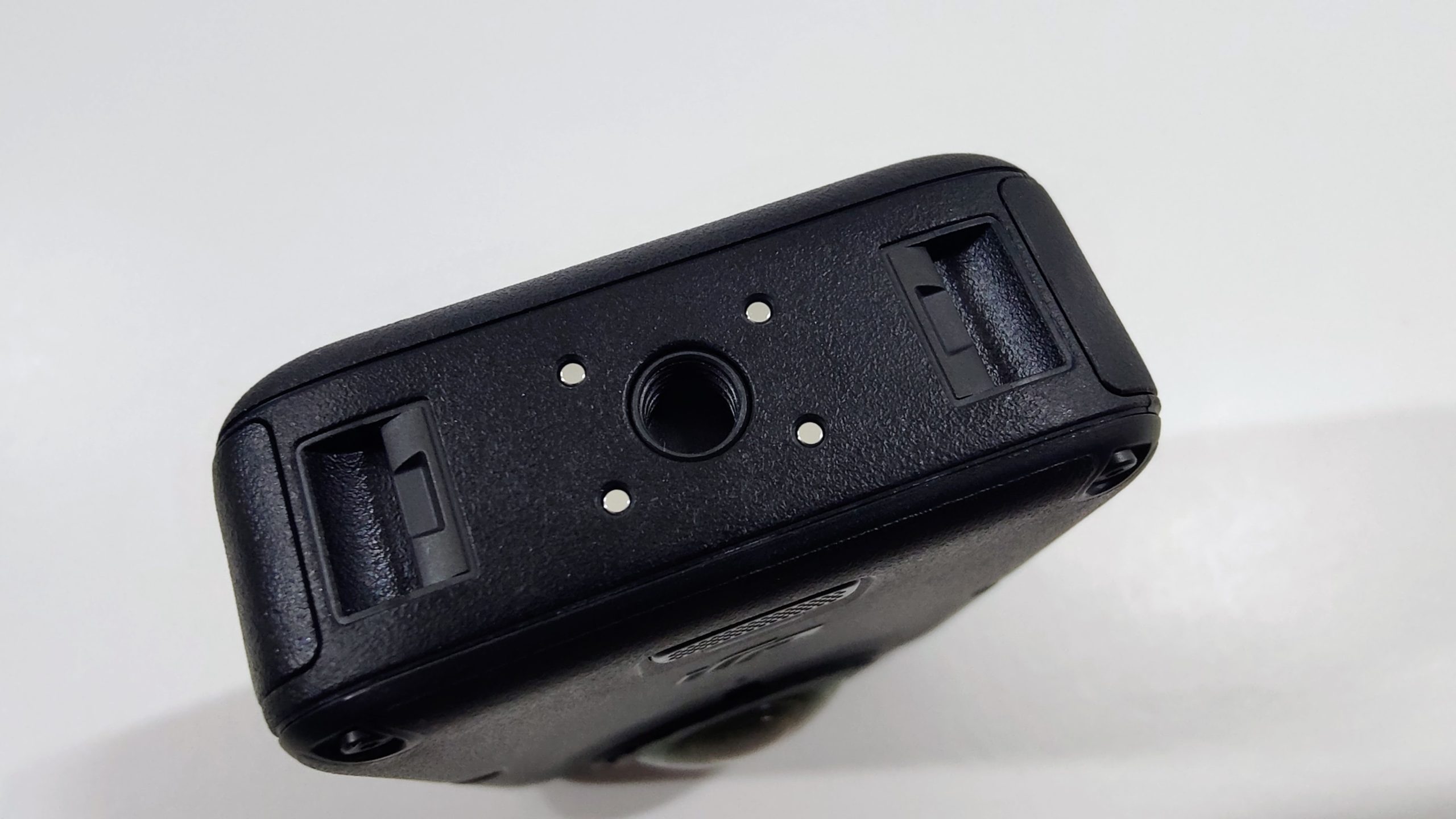 Bottom of the 360 camera with quick-release slots and a tripod thread.